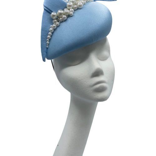 Baby blue teardrop shaped headpiece with pearl detail.